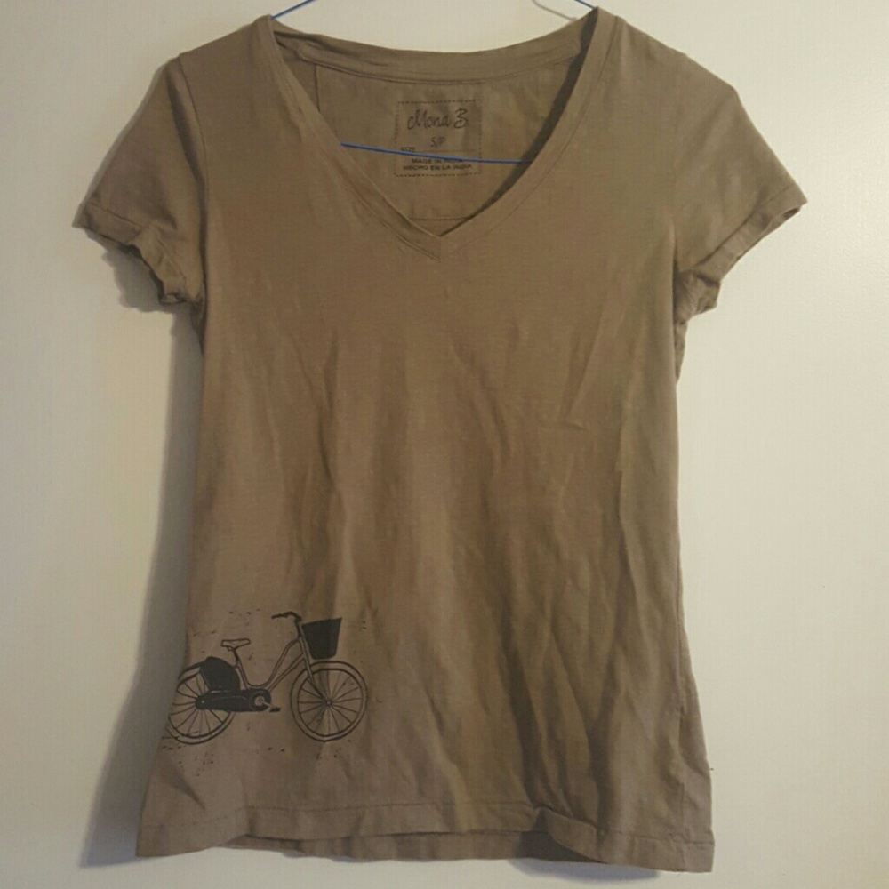 Cute Mona B shirt with bicycle pattern on bottom.