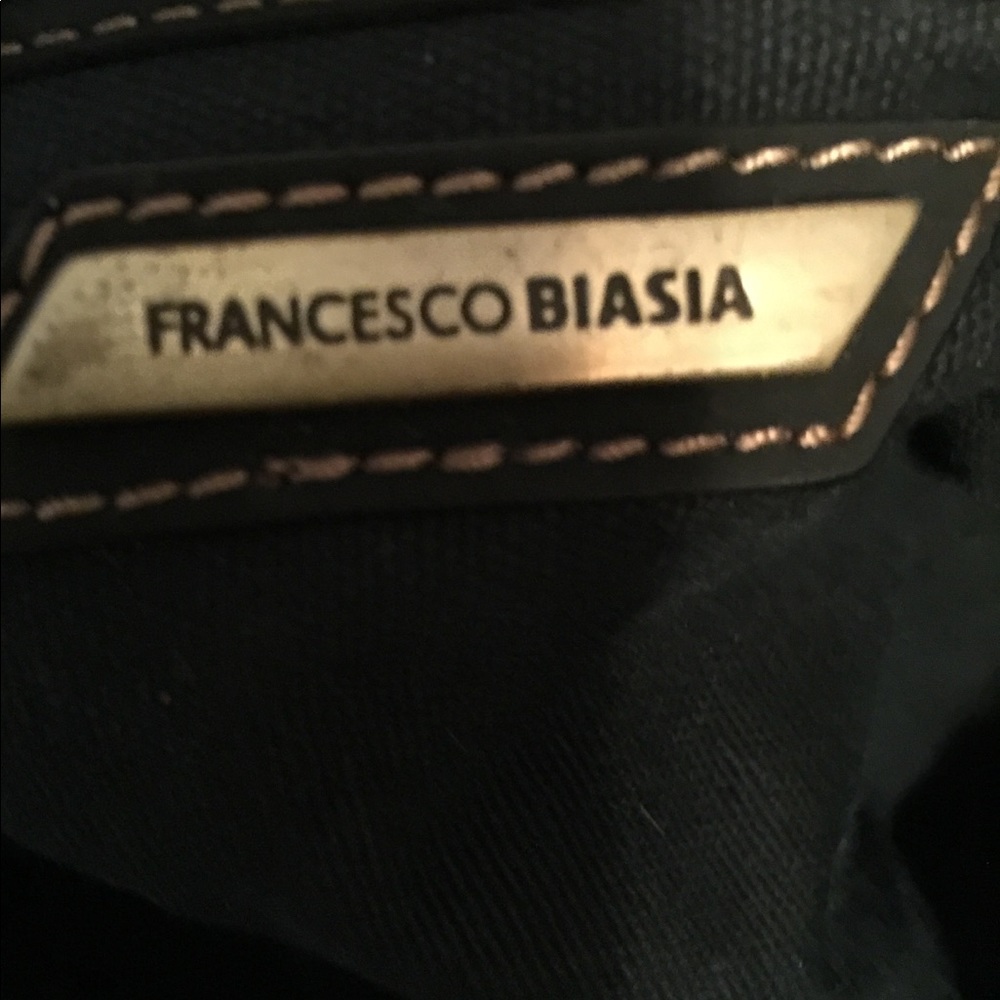 Weaved leather purse by Francesco biasia