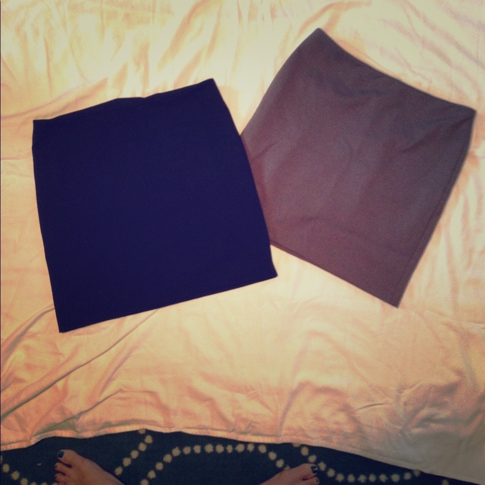 Pair of dressy zip back knee length skirts