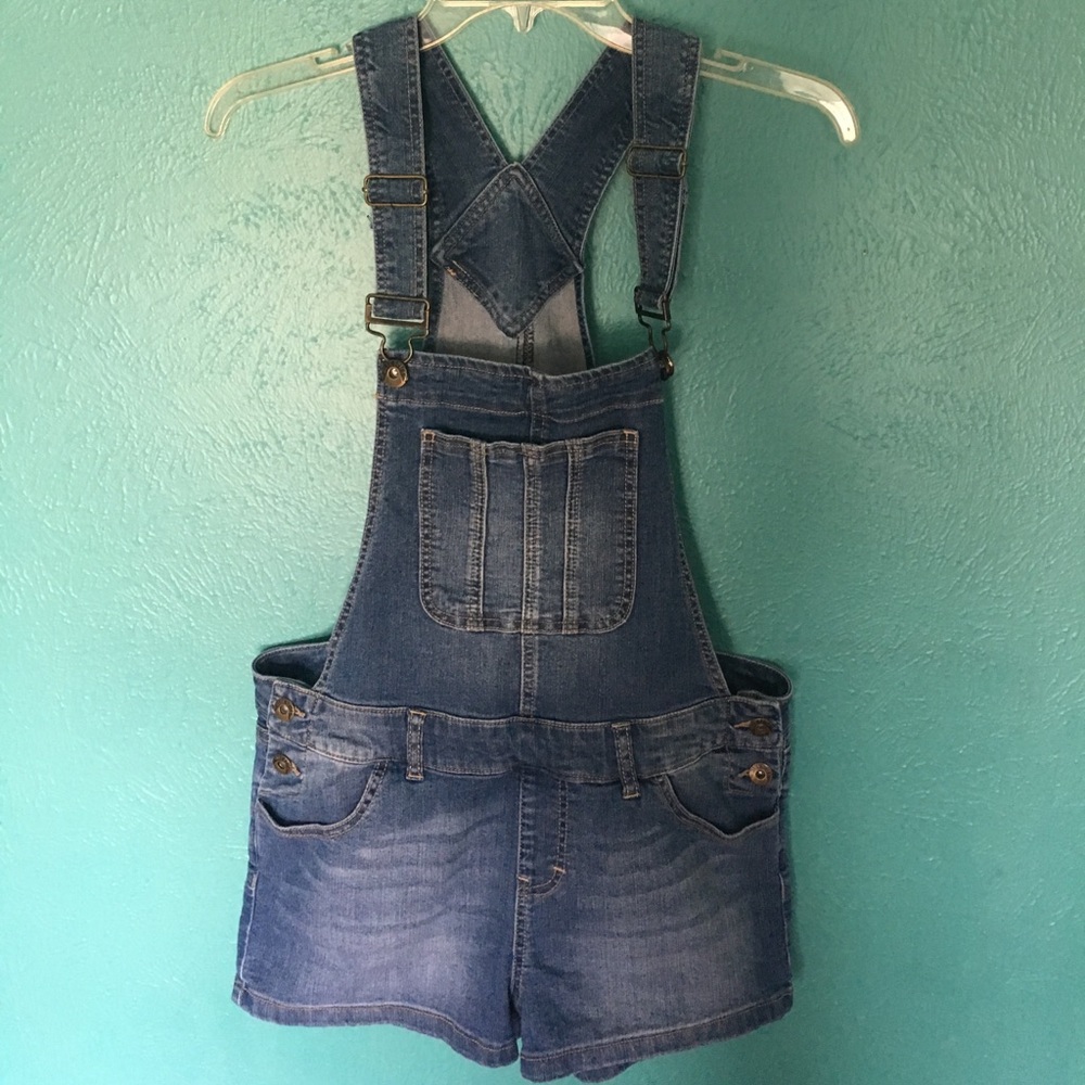 Overall shorts.