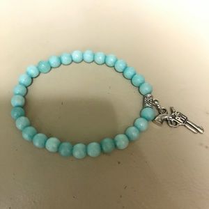Beaded bracelet with gun charm