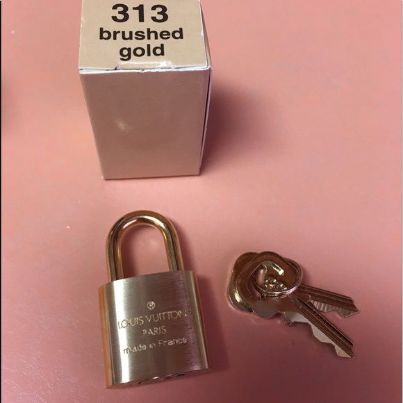 NIB Louis Vuitton Lock and key (brushed gold) - Picture 2 of 2