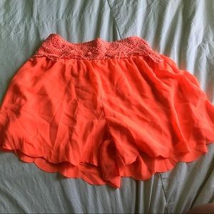 Bright orange flowy never worn high waisted shorts