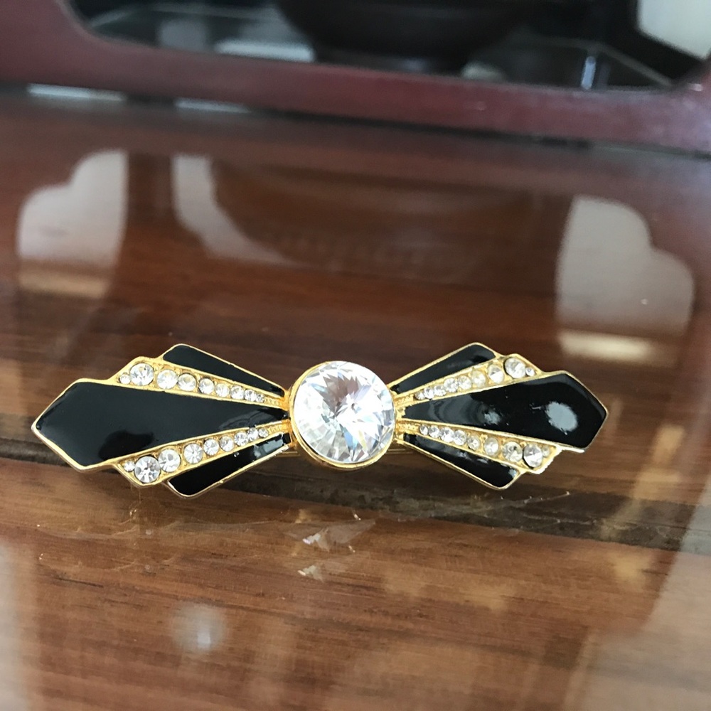 Elegant black and gold Gil's brooch