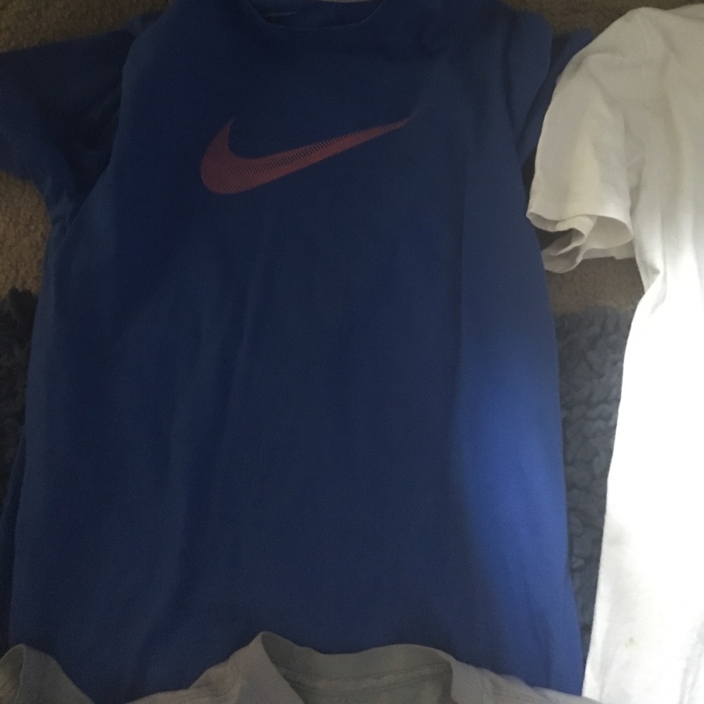 Three Nike shirts