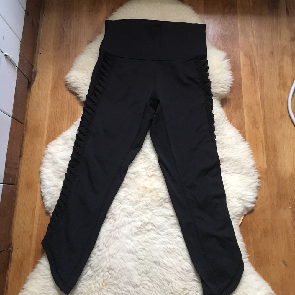 Lululemon crops with sexy ribboned mesh side bar.