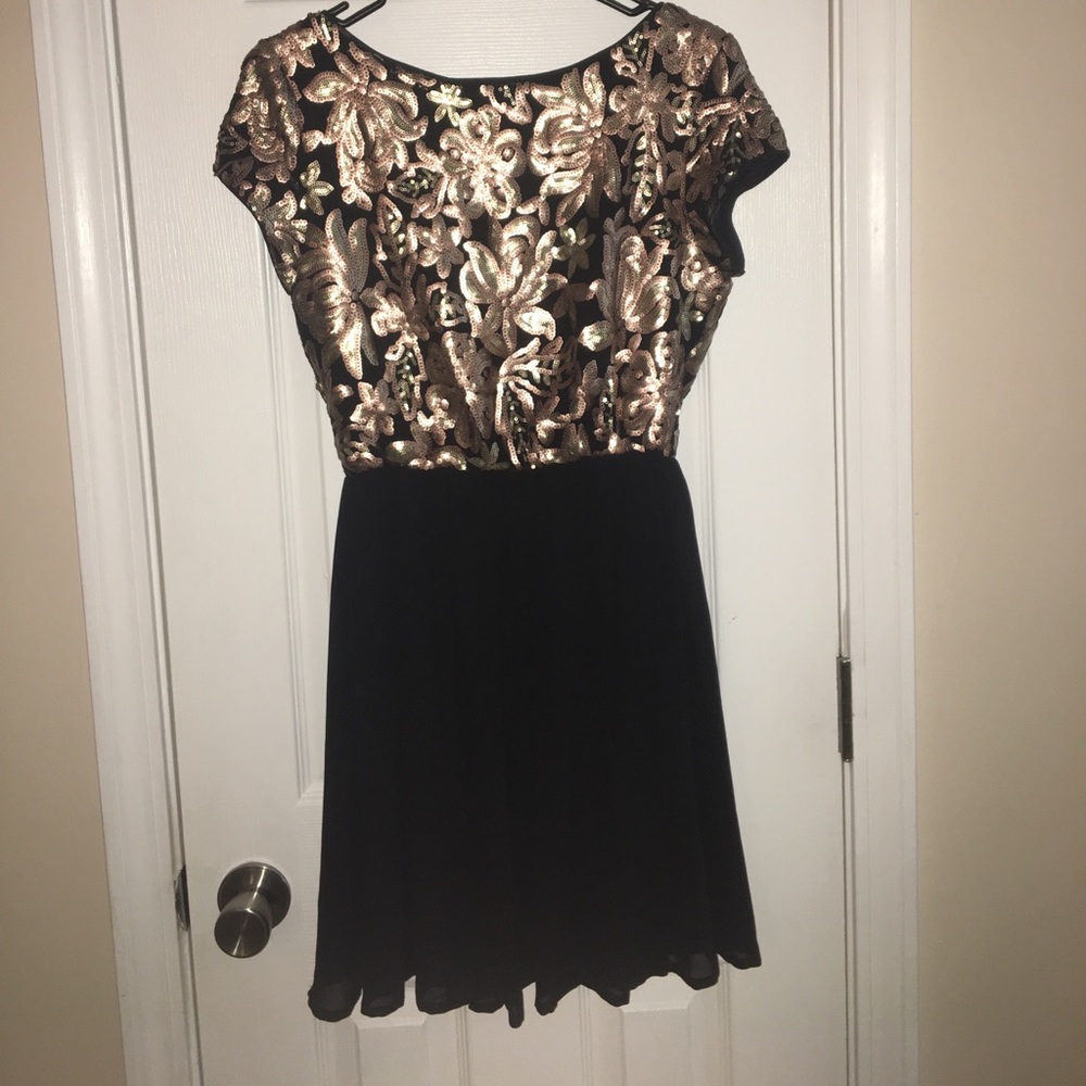 Black and gold sequin dress