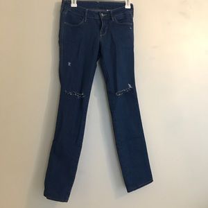 Low rise jeans with ripped knees