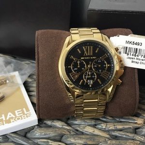Gold Michael Kors watch with black face