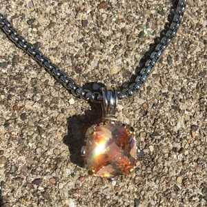 Gold/copper color pendant on silver chain necklace