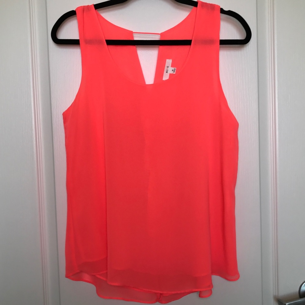 Neon coral blouse with gold spike buttons