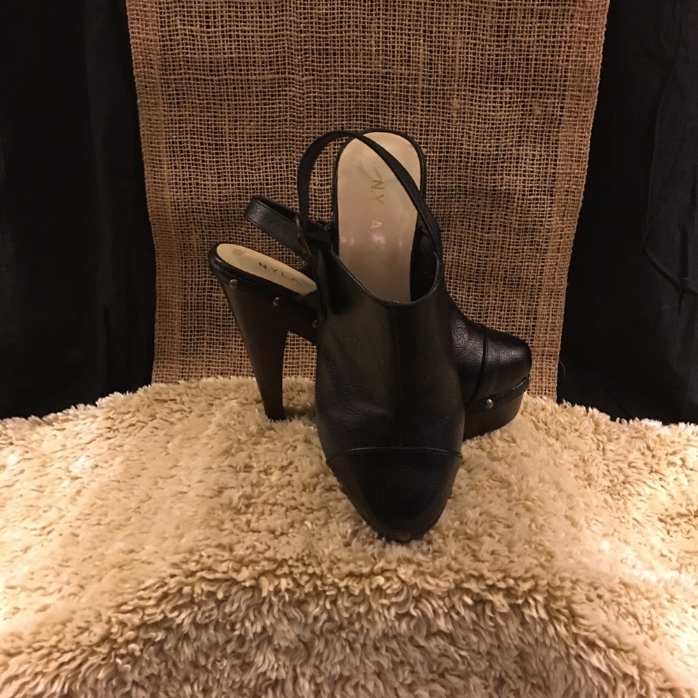 Black leather high heel clogs by N.Y.L.A.