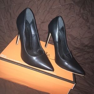 Black leather pumps