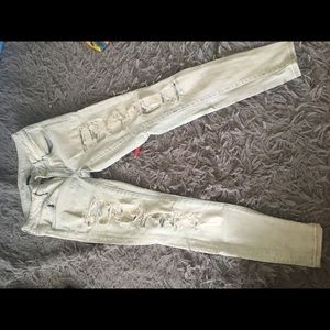 ripped light blue denim jeans