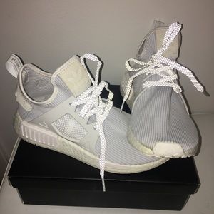 Adidas NMD gym shoes with reflective laces