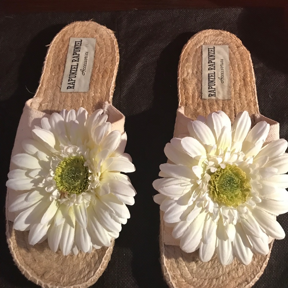 Rapunzel brand new slippers, size 8.