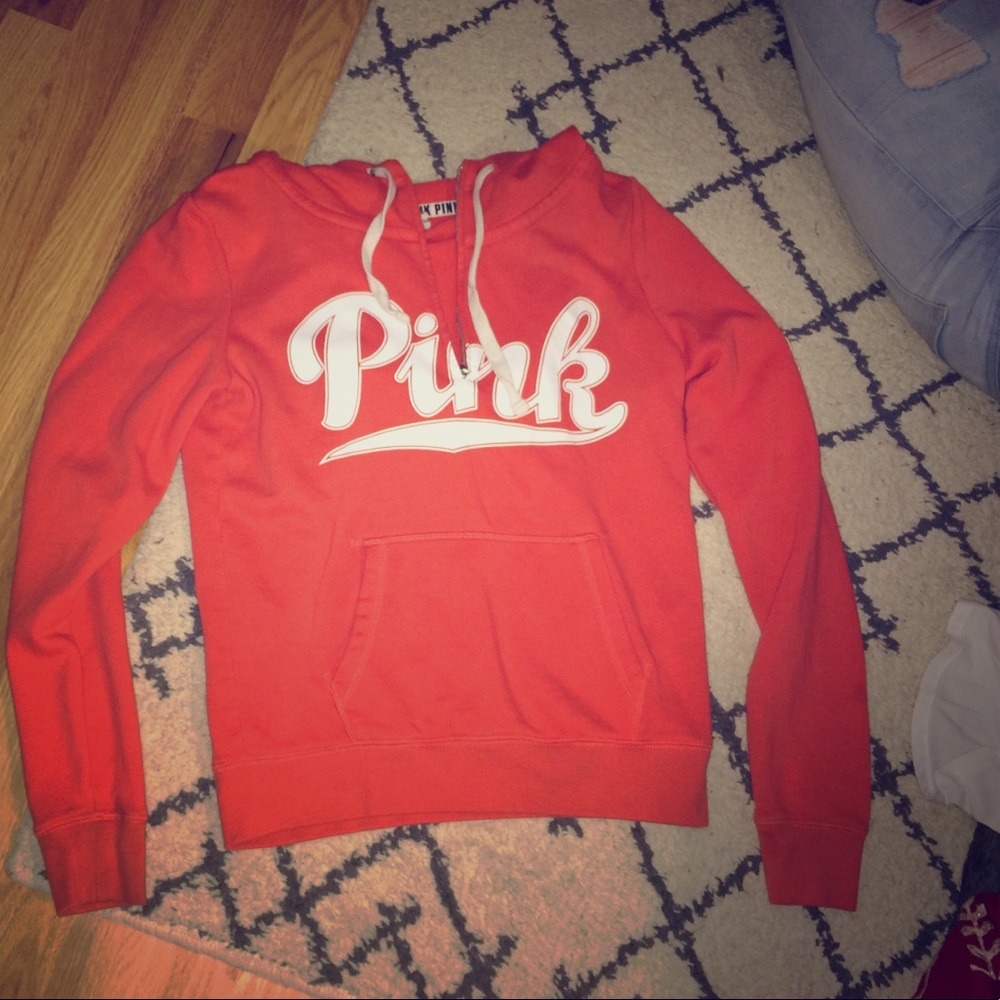 Pink sweatshirt.