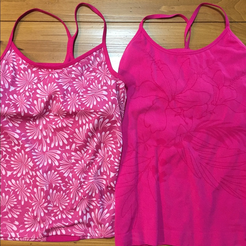 SOLD.   Two work out tanks with built in bras