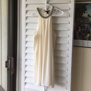 White shift dress with silver beading on the neck