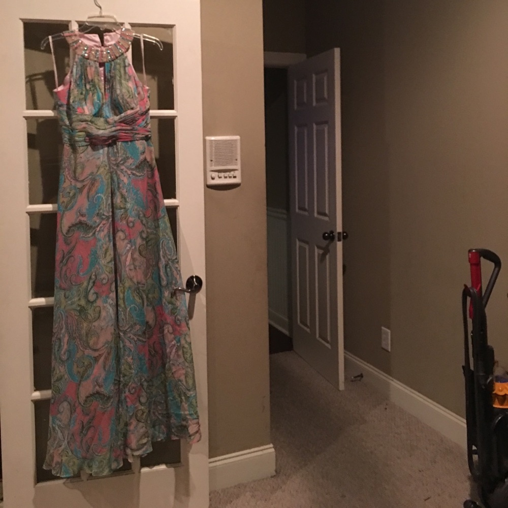 A long multicolored formal dress.