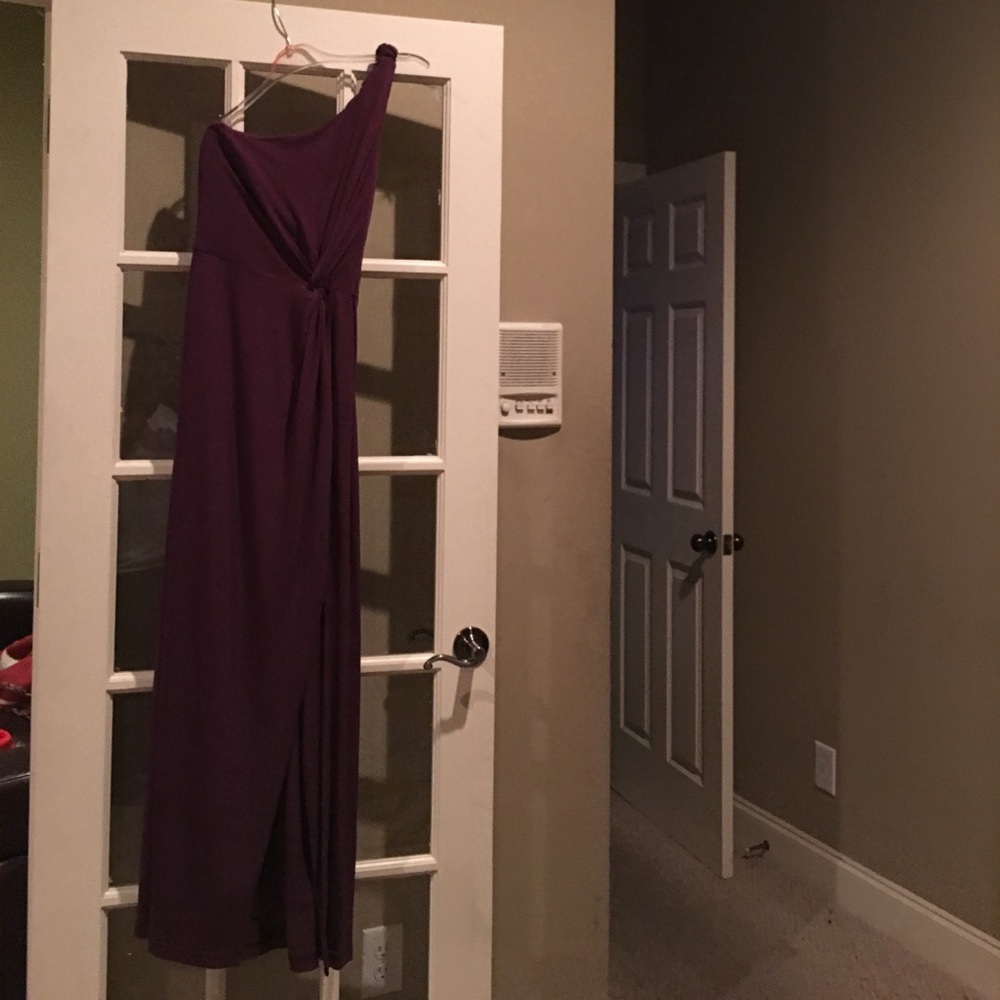 A purple braided one shoulder dress.