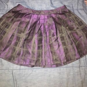 Pleated metallic purple and black mini skirt