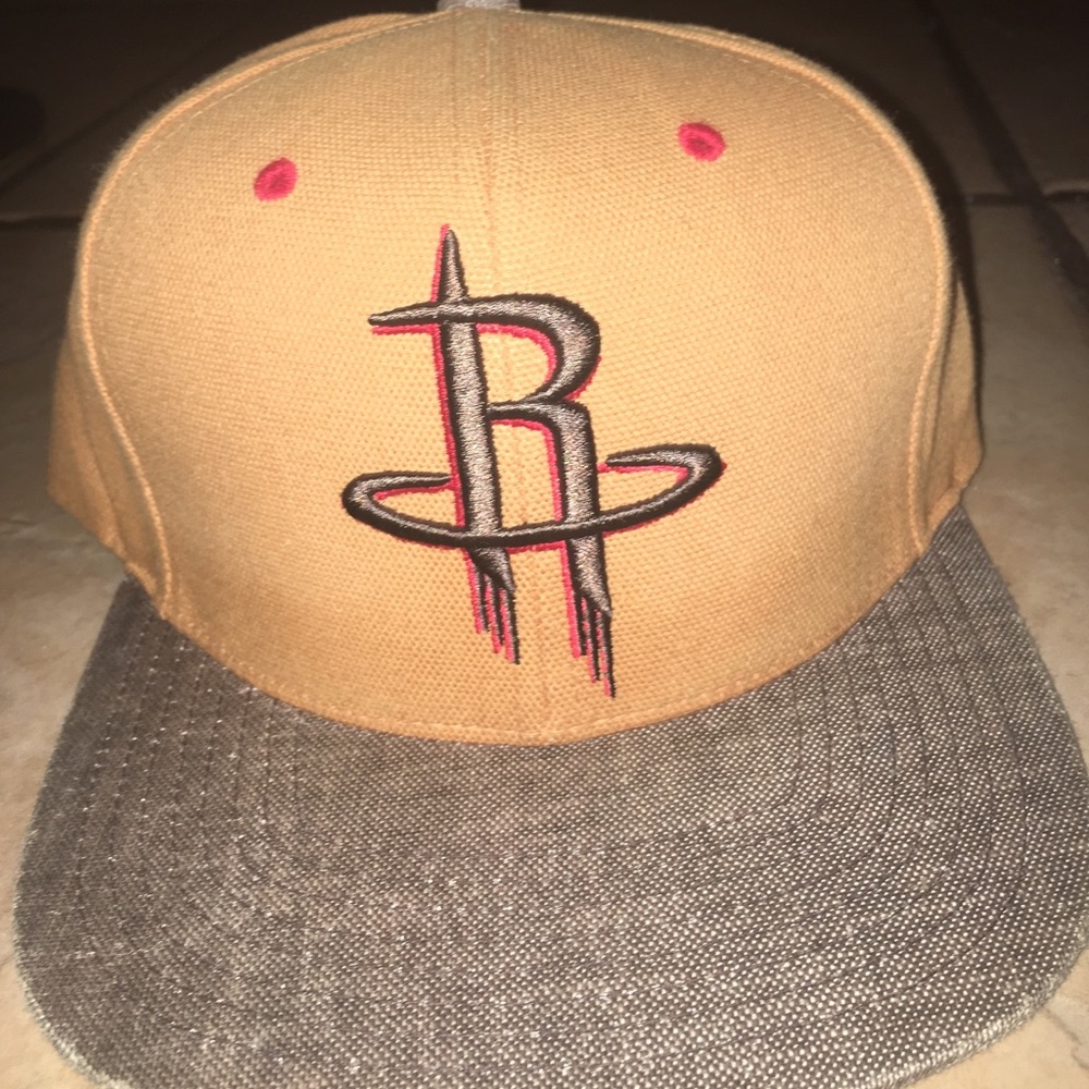 Light brown hat with red liner