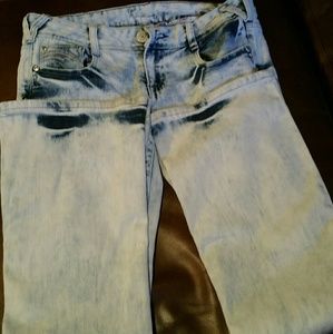 A pair of stonewashed Amethyst boot leg cut jeans