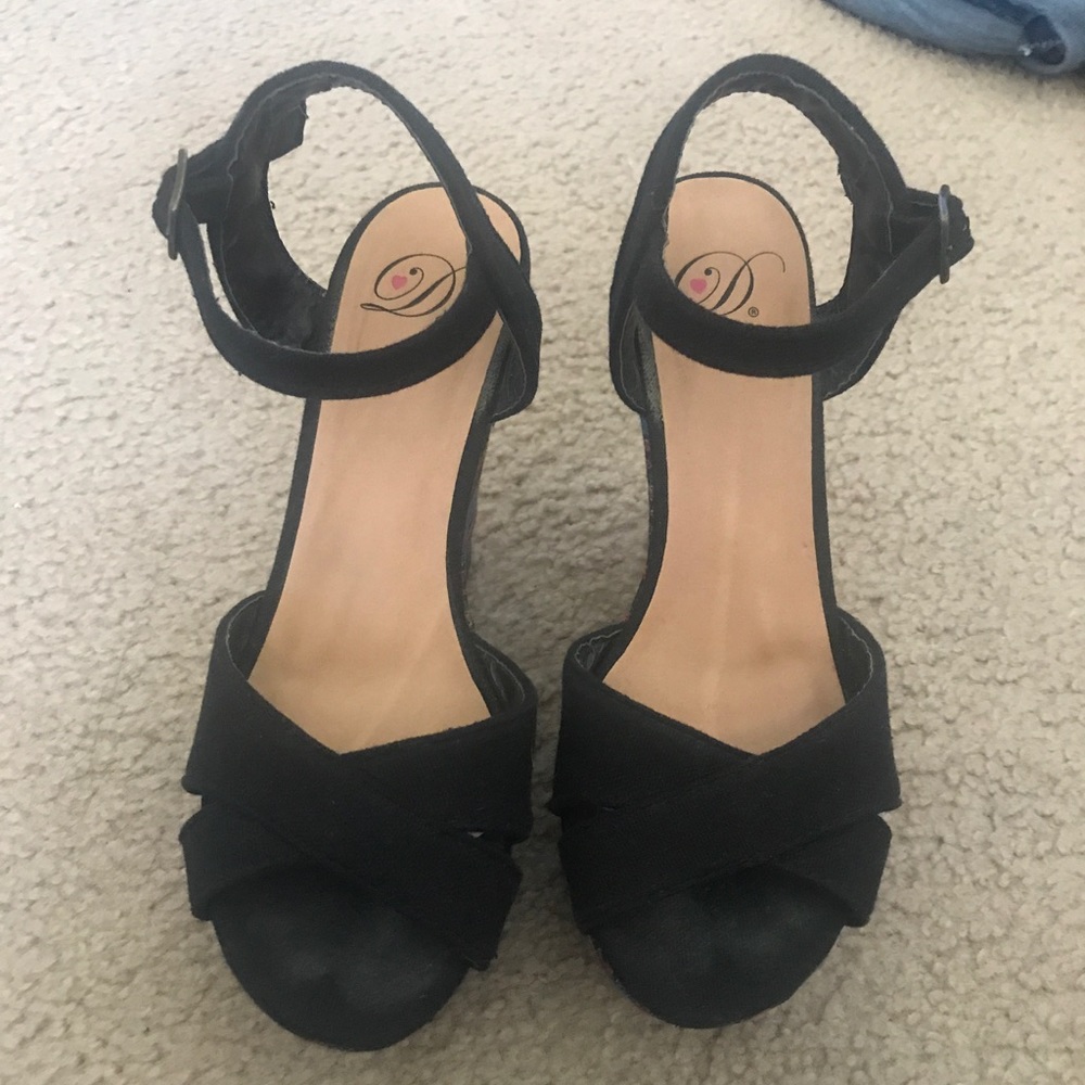 Black wedges with multi-color design on wedge.