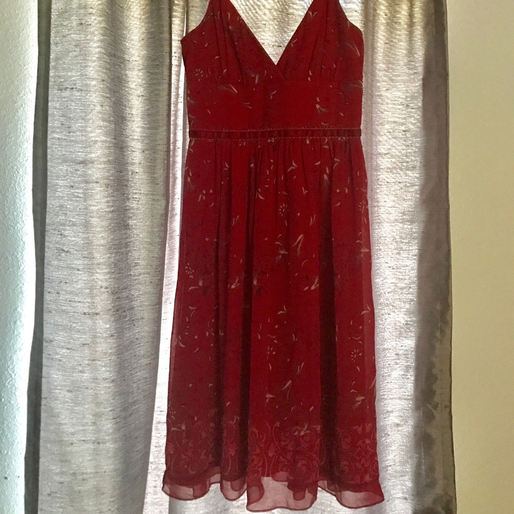 Lady in red chiffon dress.