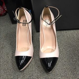 Pink and black platform heels