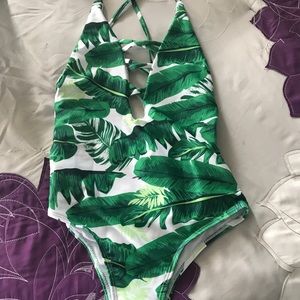 Trendi one piece bathing suit.