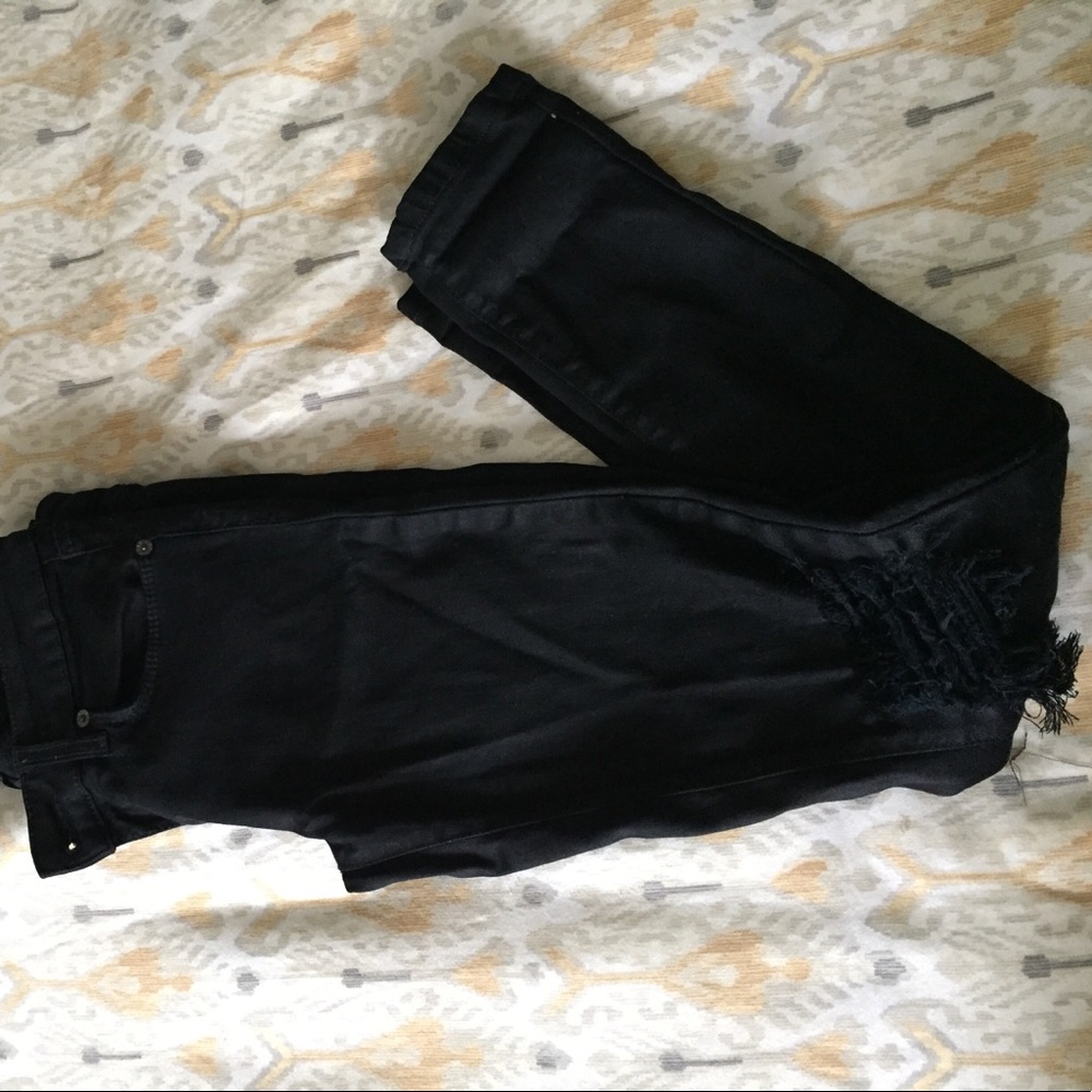 Black carmar skinny jeans with holes in both knees