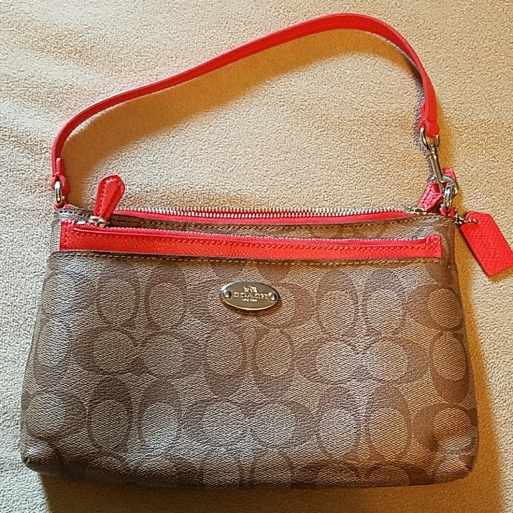 Coach clutch/wristlet purse.
