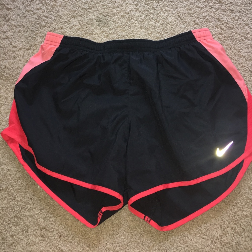 Coral and black Nike shorts