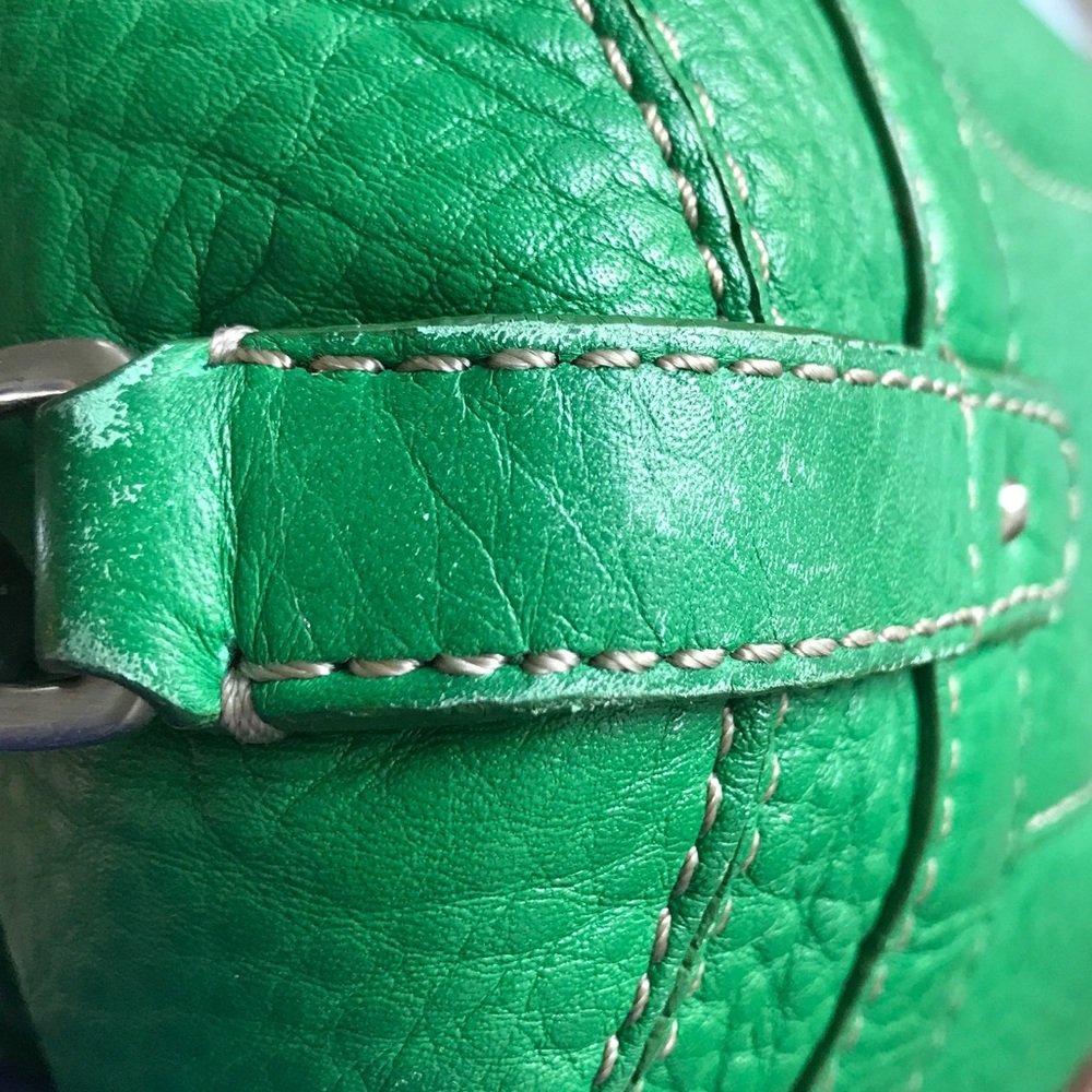 Photos of bottom corners of Cole Haan bag