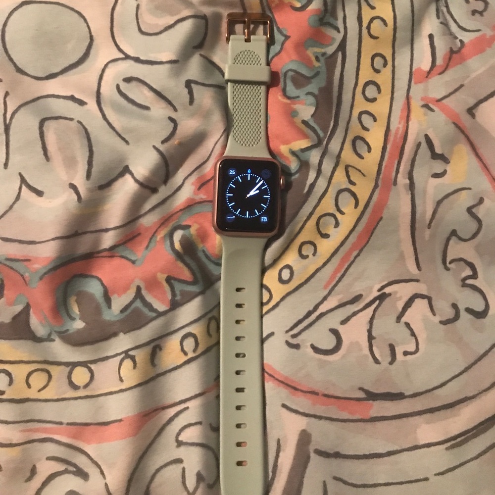 Apple Watch 38 mm with accessories and charger.