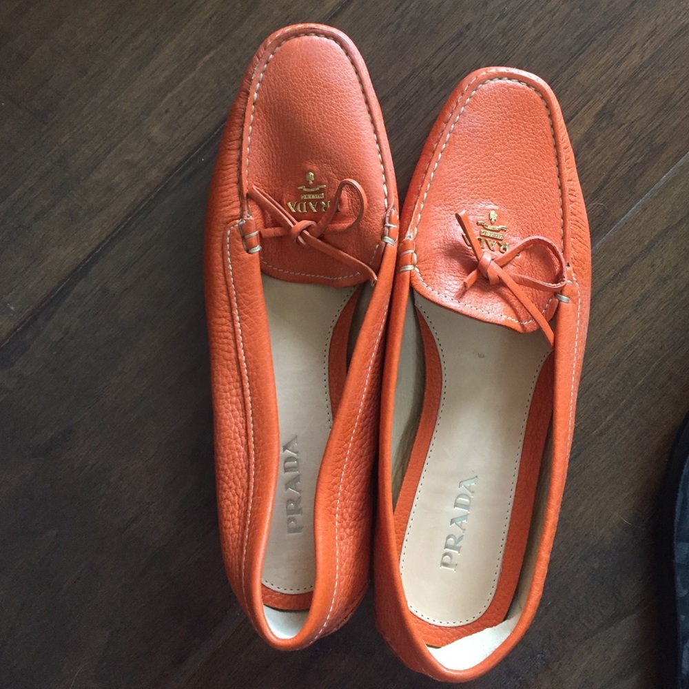 Bright orange Prada loafers