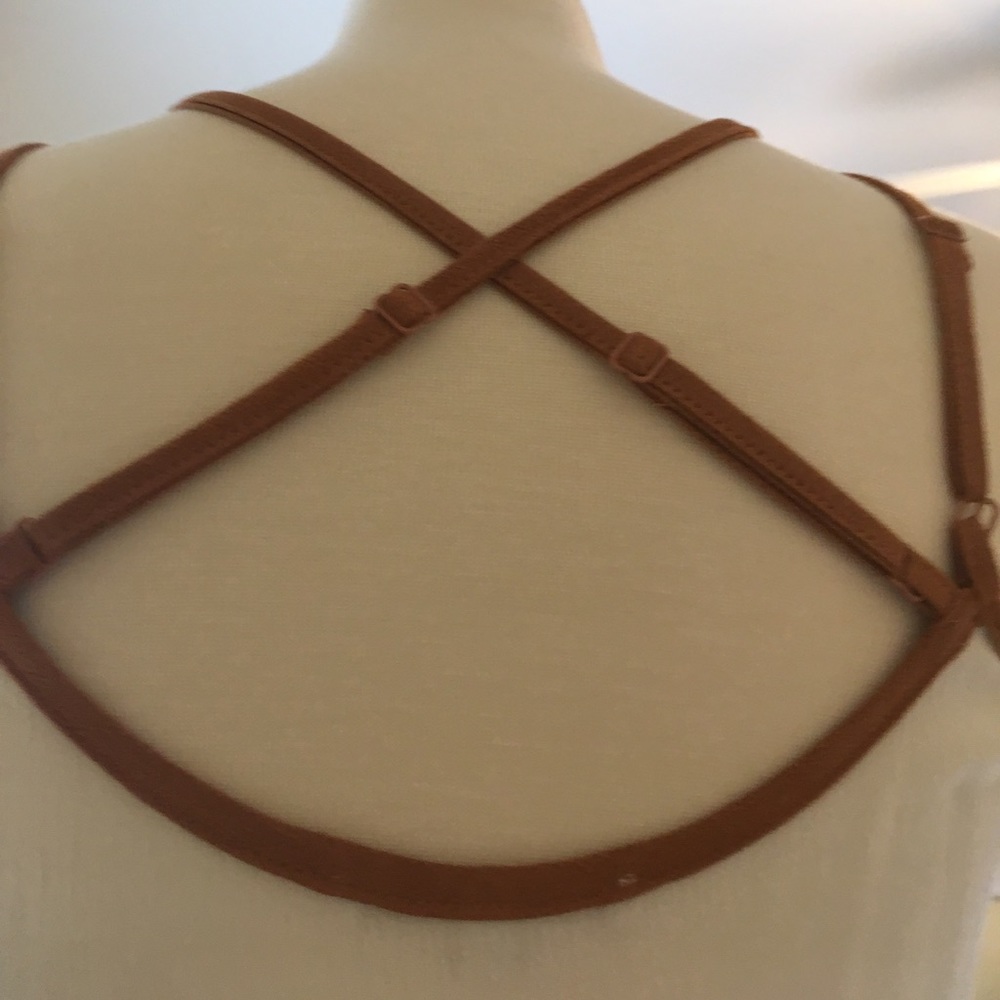 A white dress with pretty designs on the front. - Picture 5 of 6