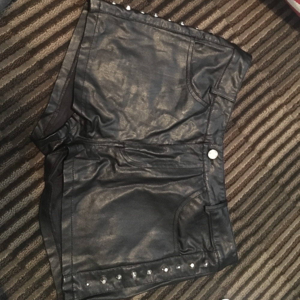 Black leather shorts with silver studs on the side