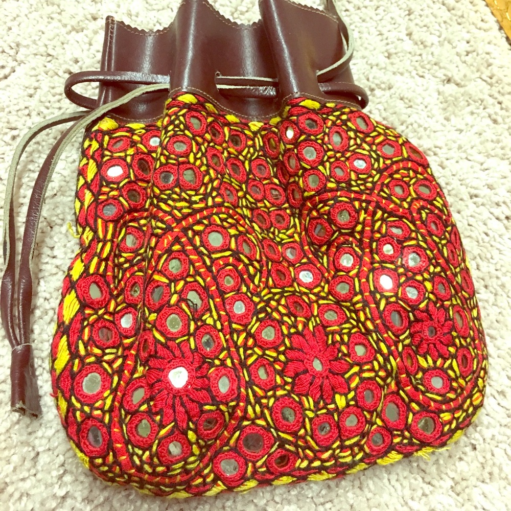 Glass and leather wristlet