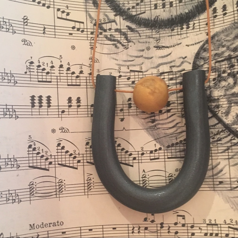 The Abbott in Black with Gold Bead