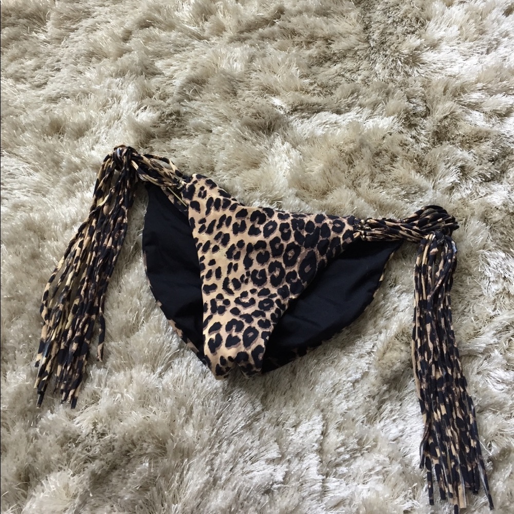 Reversible black & leopard print bikini bottom.