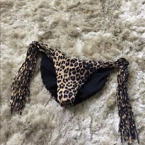 Reversible black & leopard print bikini bottom.