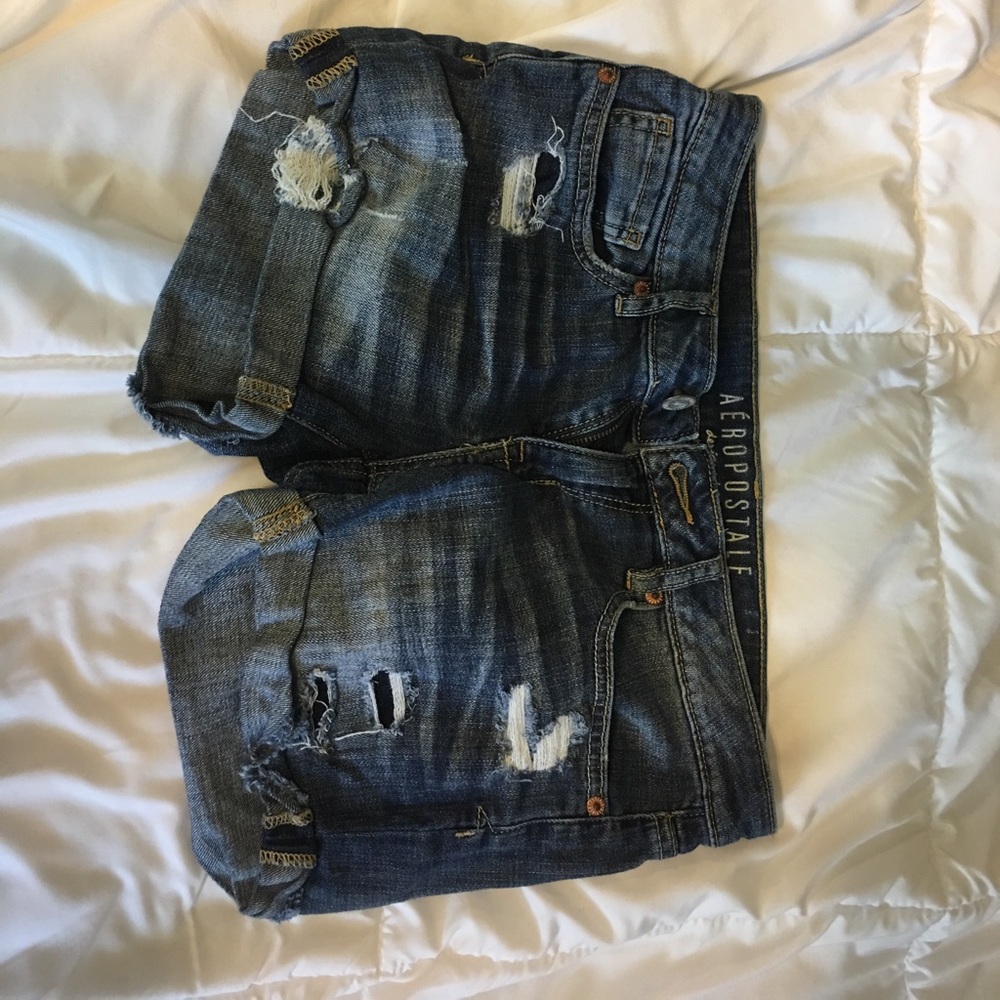 blue ripped jean shorts