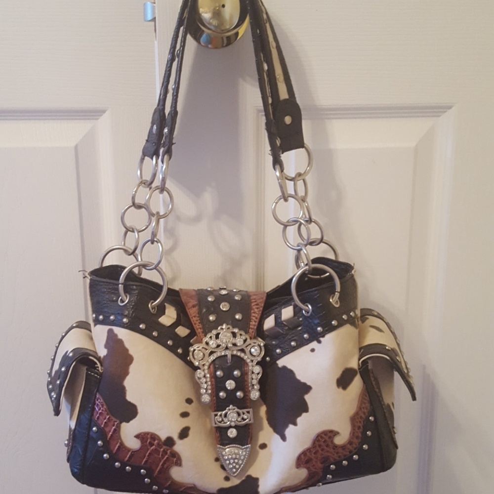 Gently used cow print purse and matching wallet