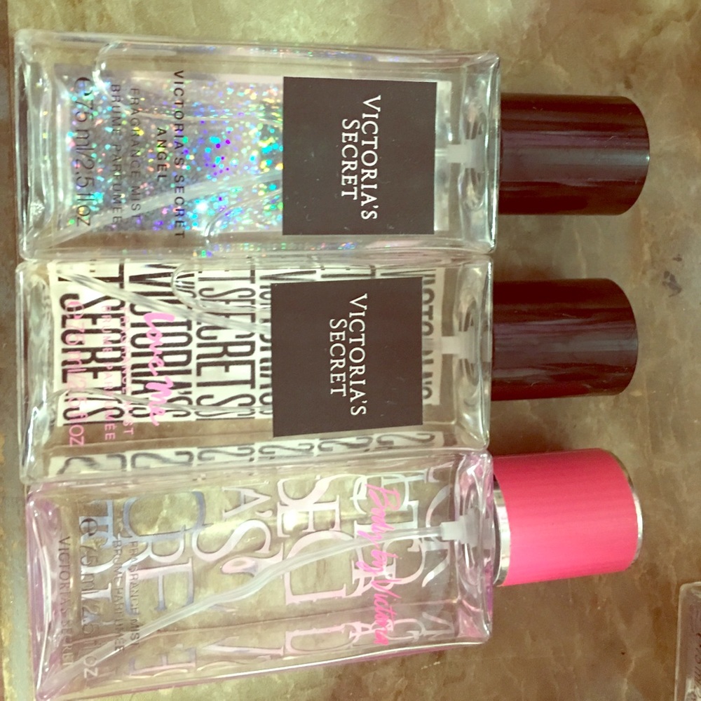 Three small, travel size Victoria Body Spray