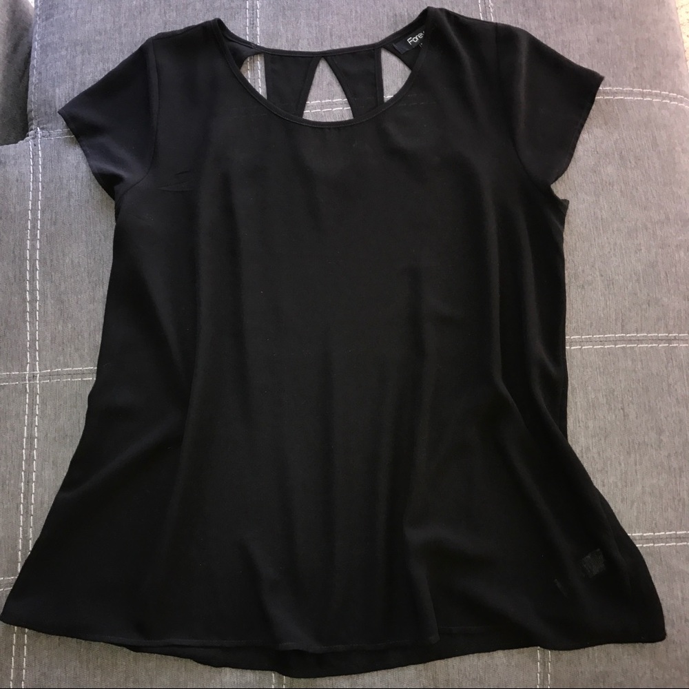 Black top with keyhole cutouts on the back