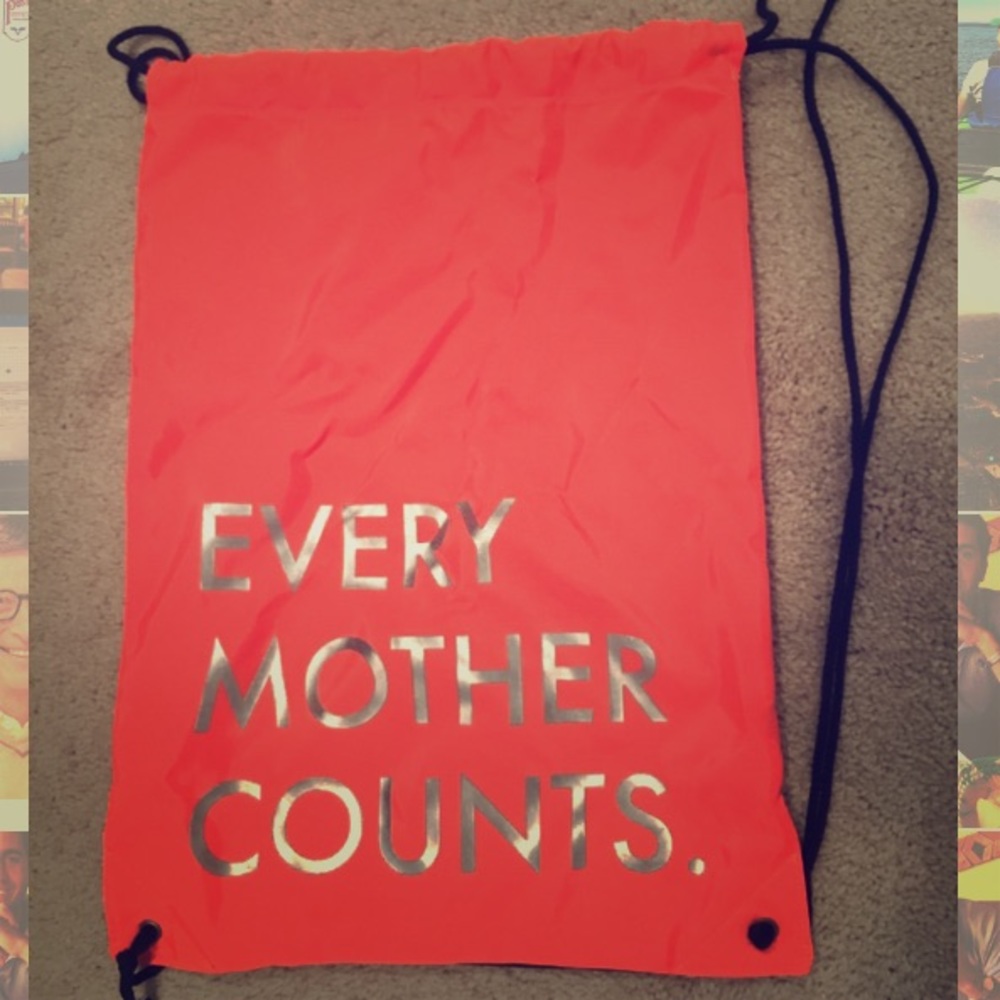 Every Mother Counts drawstring bag. Neon orange