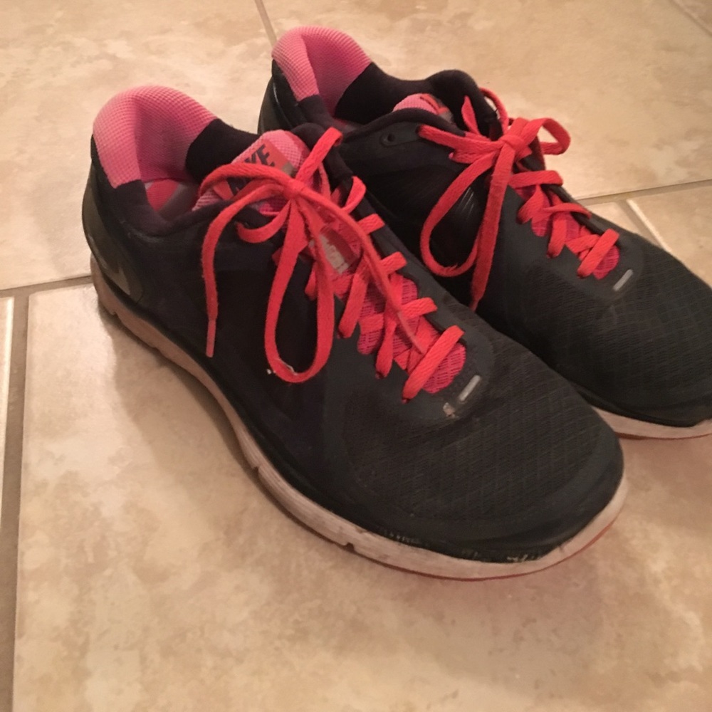 Dark grey and pink nike tennis shoes